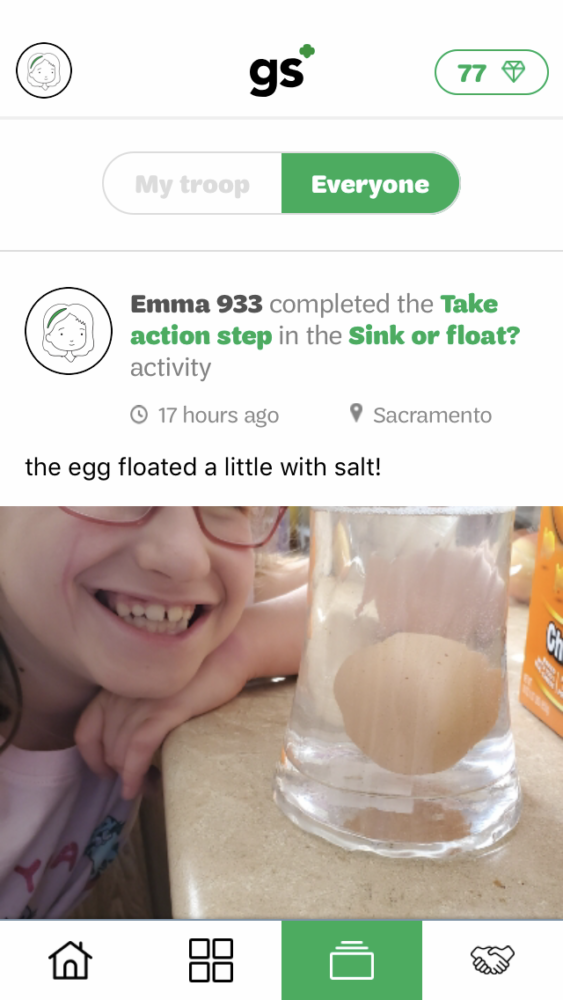 A screen shot from a mobile app of a girl doing an egg experiment